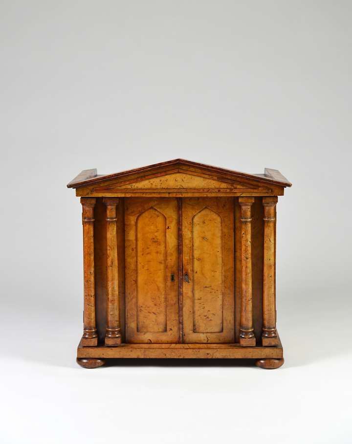 A fine burr elm collectors cabinet of architectural form